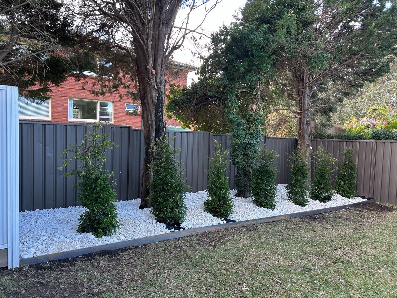 Back garden after planting and a fresh white-stone finish